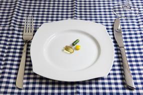 a plate of pills on the dining table