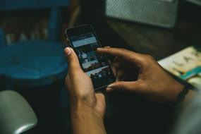 Person with the black Iphone, in the hands