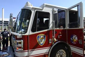 Colorful fire truck of the Houston Fire Department, near the people, in Texas, UA