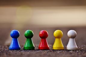 Colorful, shiny figures on the asphalt