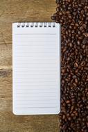 notebook and coffee beans as a concept