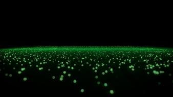 Bright, green particles at black background