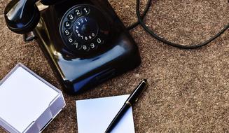 retro black telephone set on desktop