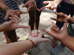 children hold hands in a circle