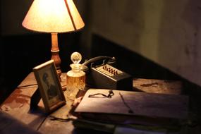 Portrait of a soldier, near the beautiful lamp, on the table