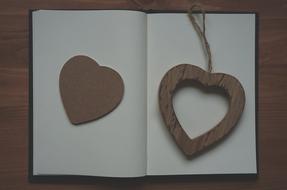 Wooden Heart on Notebook