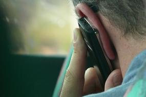 Man, talking on the phone, with colorful lights