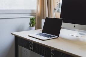 laptop and tablet on the table at home