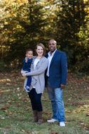 happy family with child in autumn park