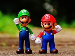 figures of Mario and Luigi with raised hands