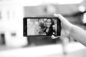 photo of people on a smartphone on a blurred background