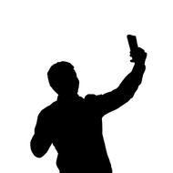silhouette of a man in a selfie pose