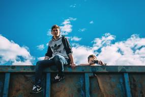 guys taking a photo sitting on the truck