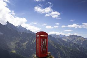 phone box on top of a mountain in the wild