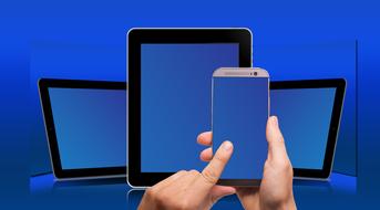 tablets, smartphone, touching the screen with a finger