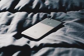Mobile Phone Electronic on the bed close-up