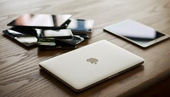 Devices Mac Communication on a wooden table close-up