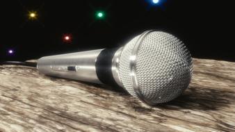 audio microphone on the table against the background of multicolored stars