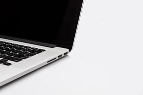 Beautiful, white and black laptop, with black screen, at white background