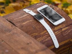 Iphone Iwatch Smartphone on wood