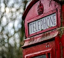 Beautiful, retro, red telephone box, at blurred background