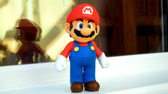 Cute, colorful and beautiful figure of Mario, near the window