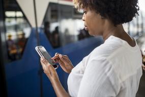 african american girl with mobile phone in hand