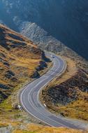 Serpentine road through Alpine Mountains