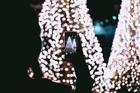 photo of christmas decoration on smartphone screen