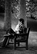 lovers on a park bench in black and white background