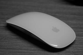 Apple Mouse on a wooden table close-up