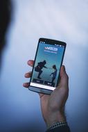 Deezer, French online music streaming service logo on screen of smartphone