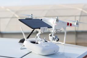 white drone on a white table