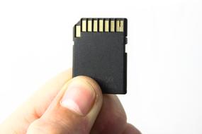 memory card in hand close up