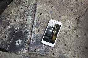 iphone lies on a steel structure