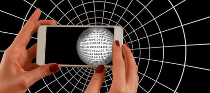 Smartphone with black and white globe with binary code, in the hands, at black and white background with network