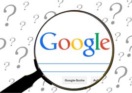 magnifier on search engine background with question marks