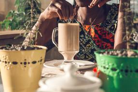 woman with coffee drink at the table