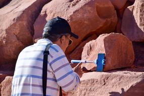 man with smartphone near the cliff