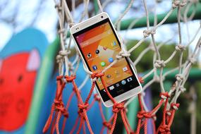 smartphone is hanging on a basketball net