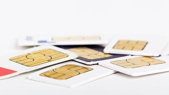 Colorful sim cards on the white surface