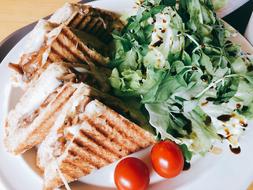 sandwiches with green salad and tomatoes