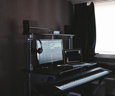 Beautiful, black Macbook with the white and black piano keyboard