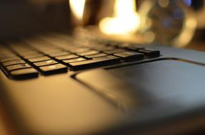 black computer keyboard close up in blurred background