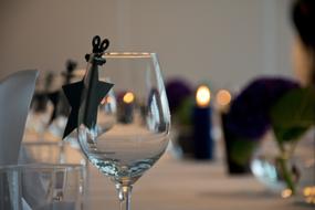 Beautiful, shiny glasses and decorations, with the lights, on the table