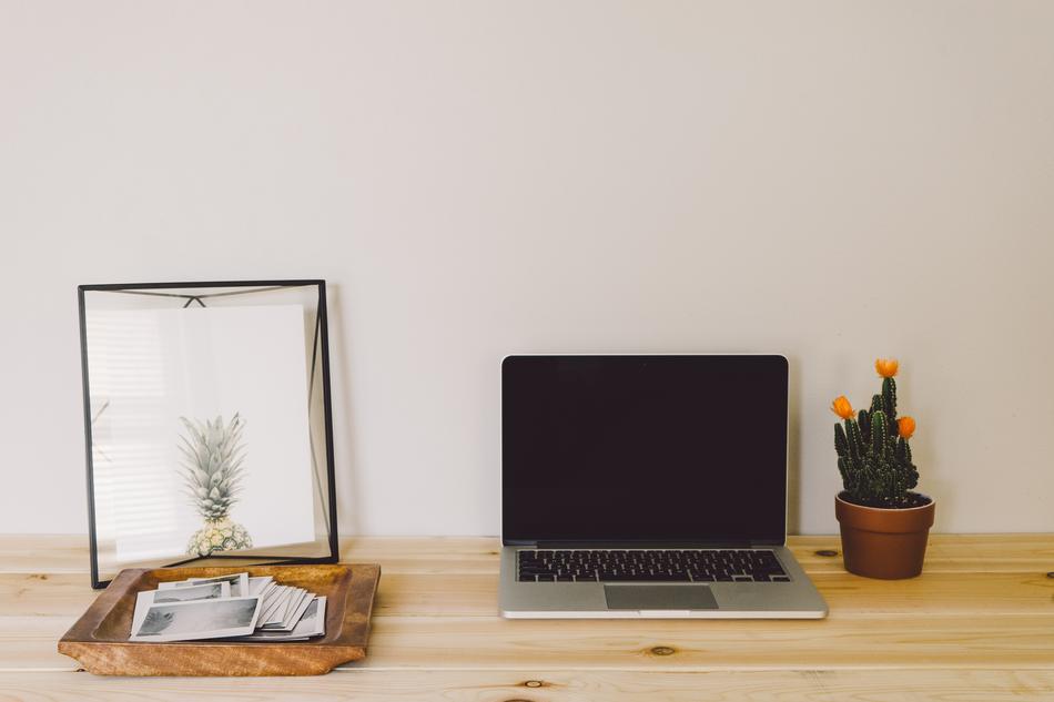 Wooden desktop with the laptop and decorations
