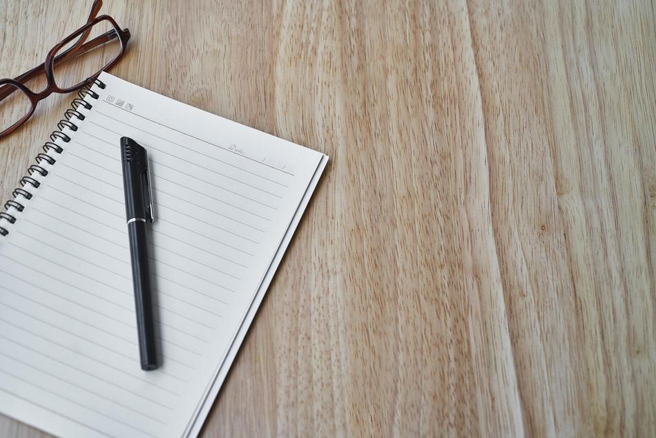 Black Pen on blank notepad