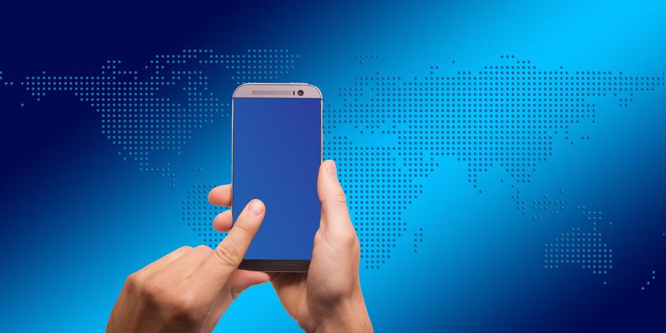 smartphone on the background of the world map