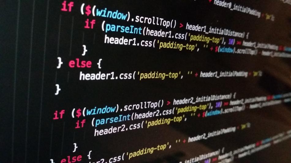 Colorful code for website on black monitor