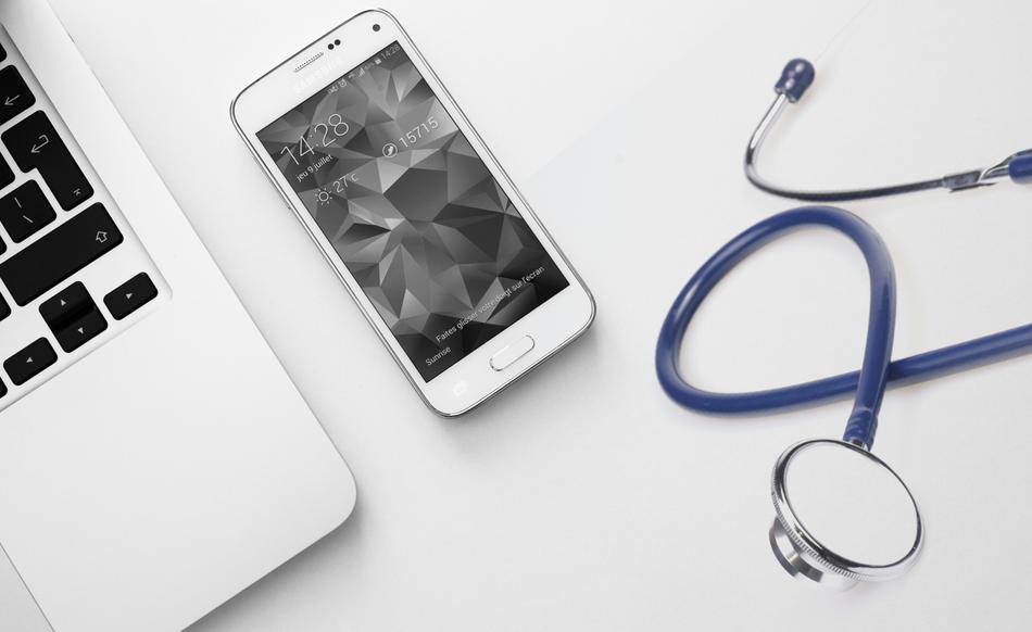 Stethoscope, smartphone and laptop pc